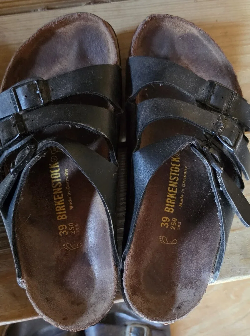 4 Pairs Size 39 Birkenstock sandals.  Very Worn.  Need Repairs.  Good Straps.